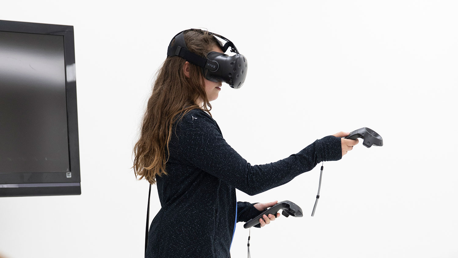 A person using a Vive V R headset.