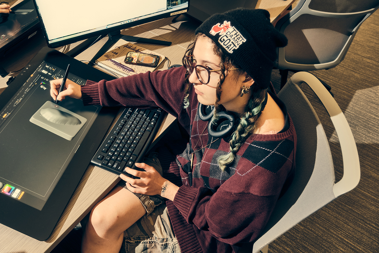 A student draws on a tablet in RIT's 3D Animation Lab during a 3D sculpting exercise.