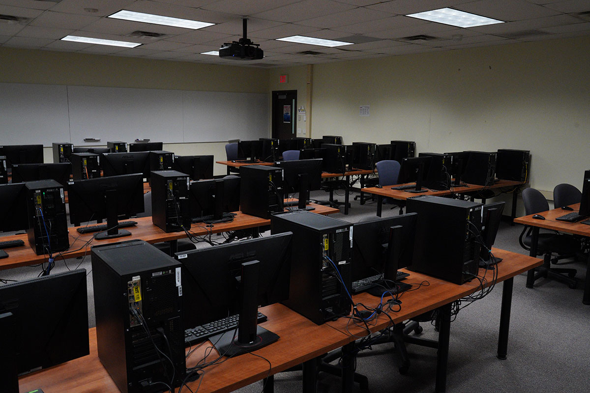 Computer lab with dark wood desks