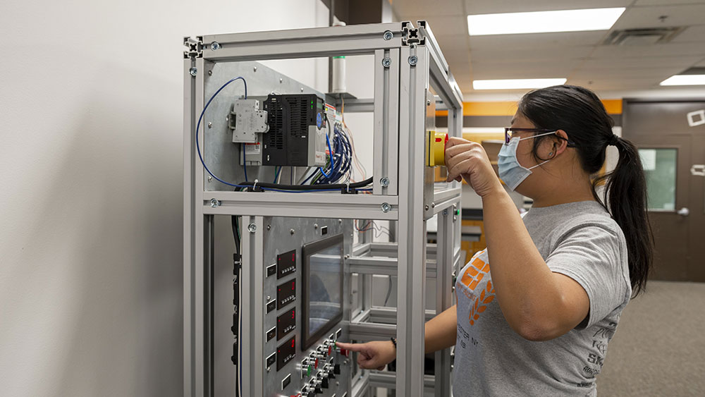 Student working with lab equipment.