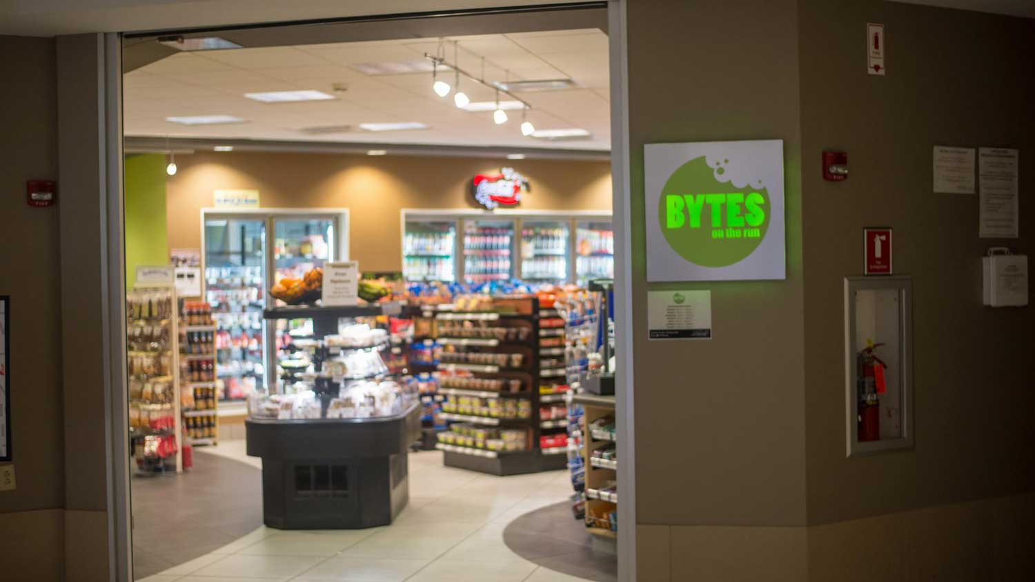 Interior of Bytes store showing racks of snacks