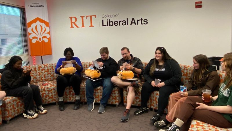 A group of students in the liberal arts hall lounge 