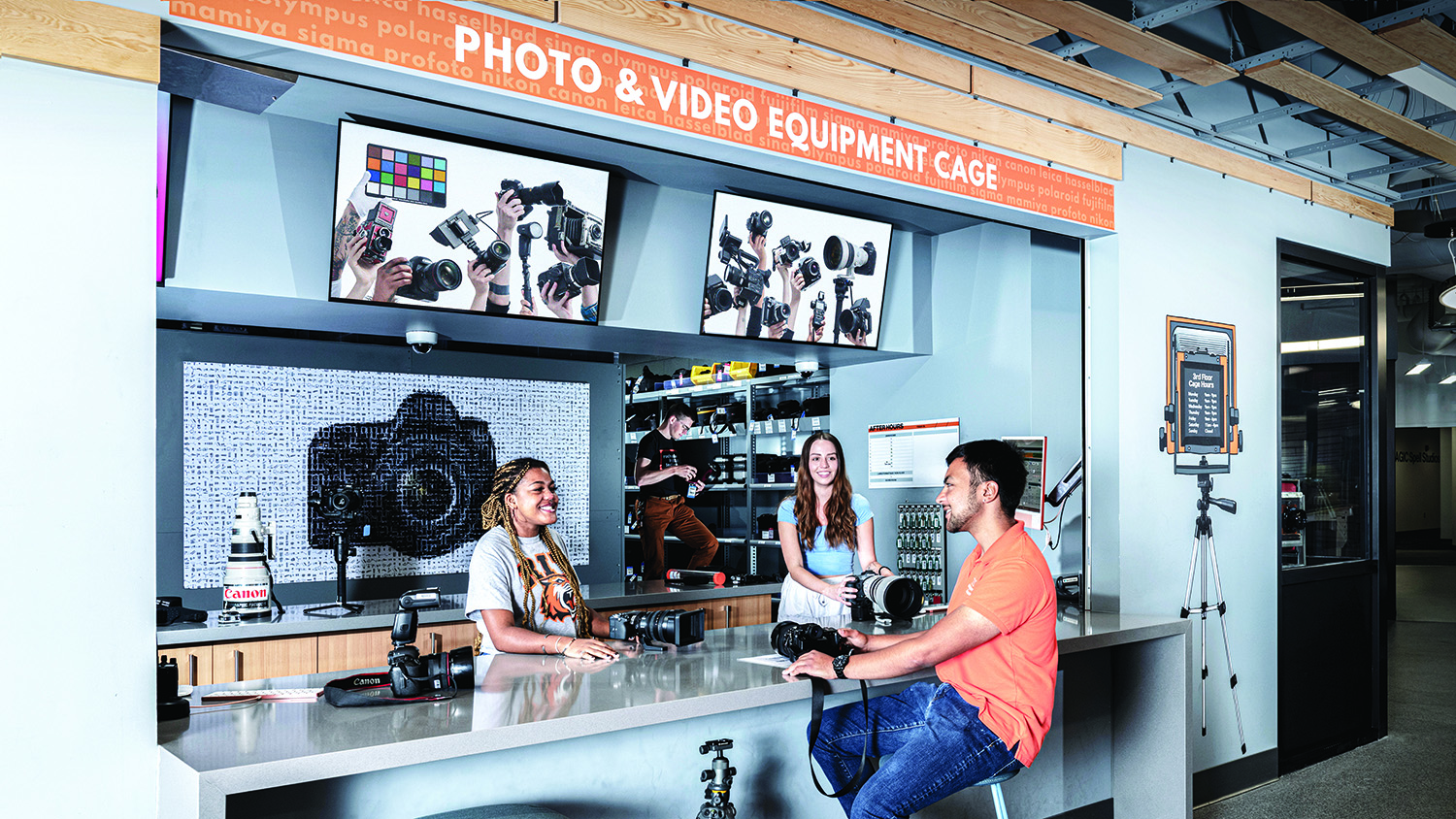 Students gather at the photo cage on the third floor of Gannett Hall.