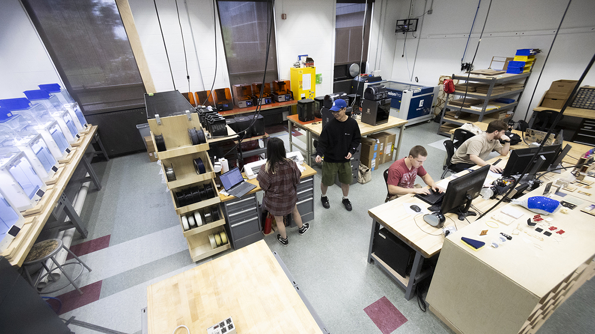 A high view of student employees working in the Fab Lab.