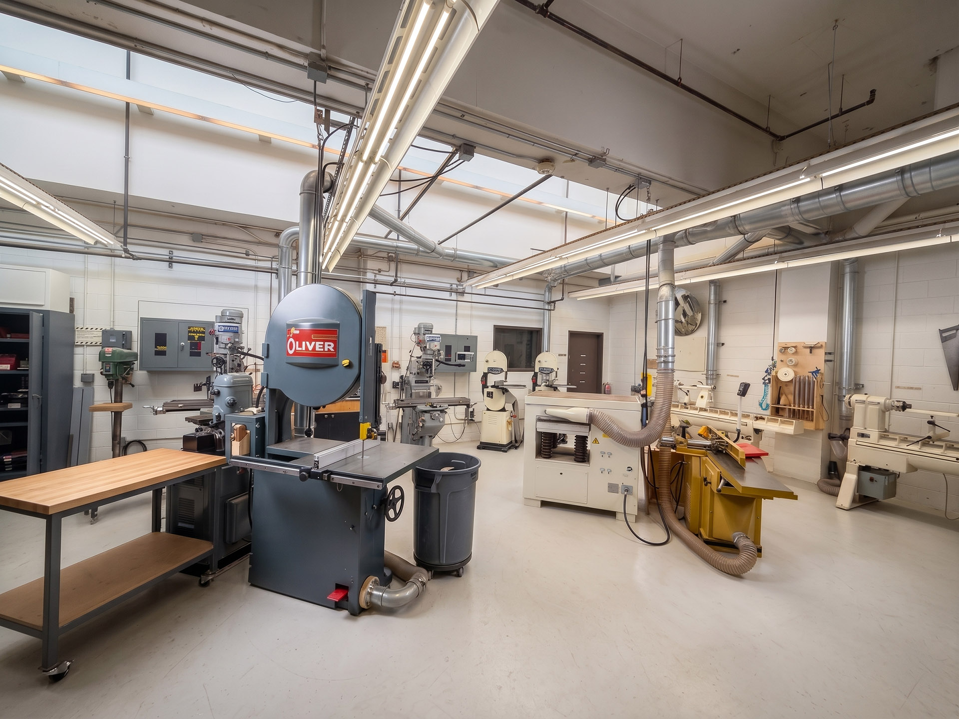Fabrication room with bandsaws, drill presses, and other equipment