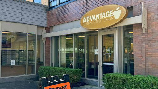 Front facing view of the Advantage F C U building in Global Village.
