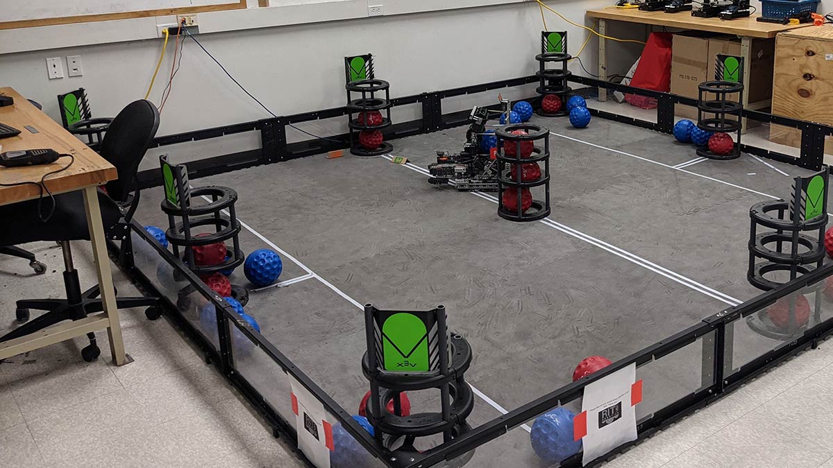 an obstacle course for robots in which it needs to place a ball in a cylindrical container.