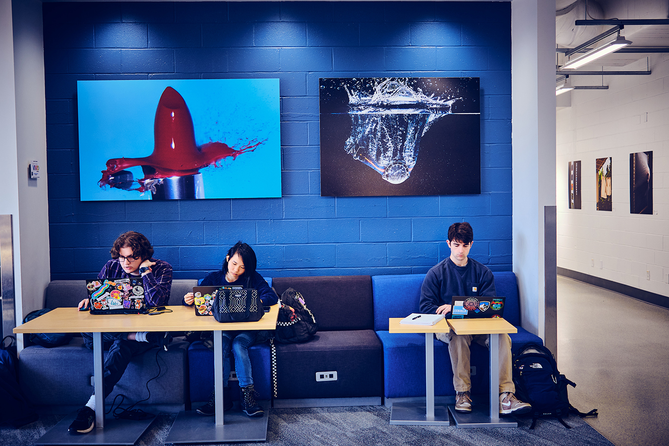 Students work at tables in Airport Lounge.