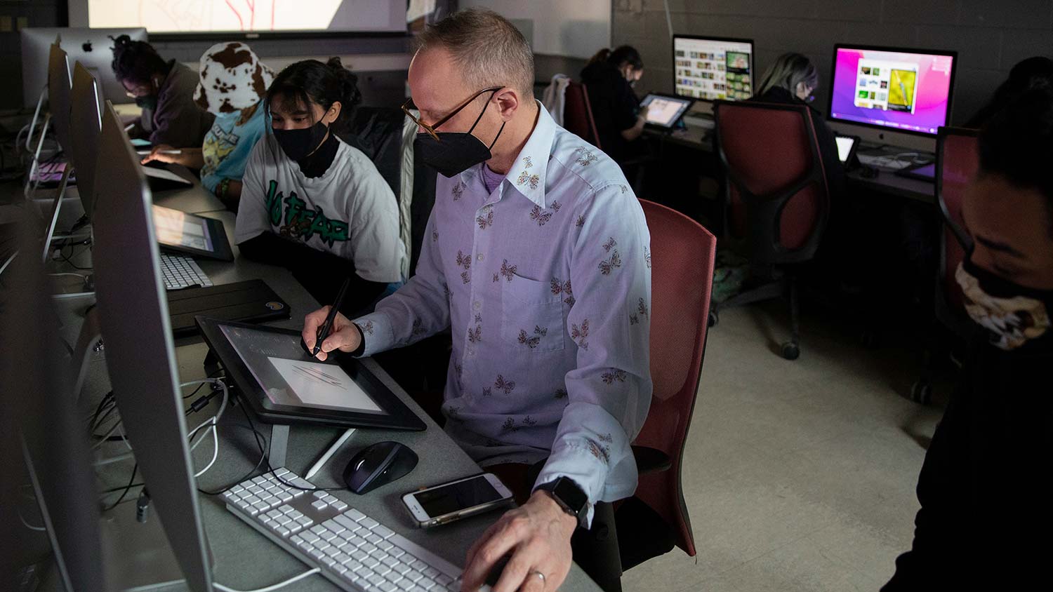 Professor Chad Grohman teaches illustration in a computer lab.