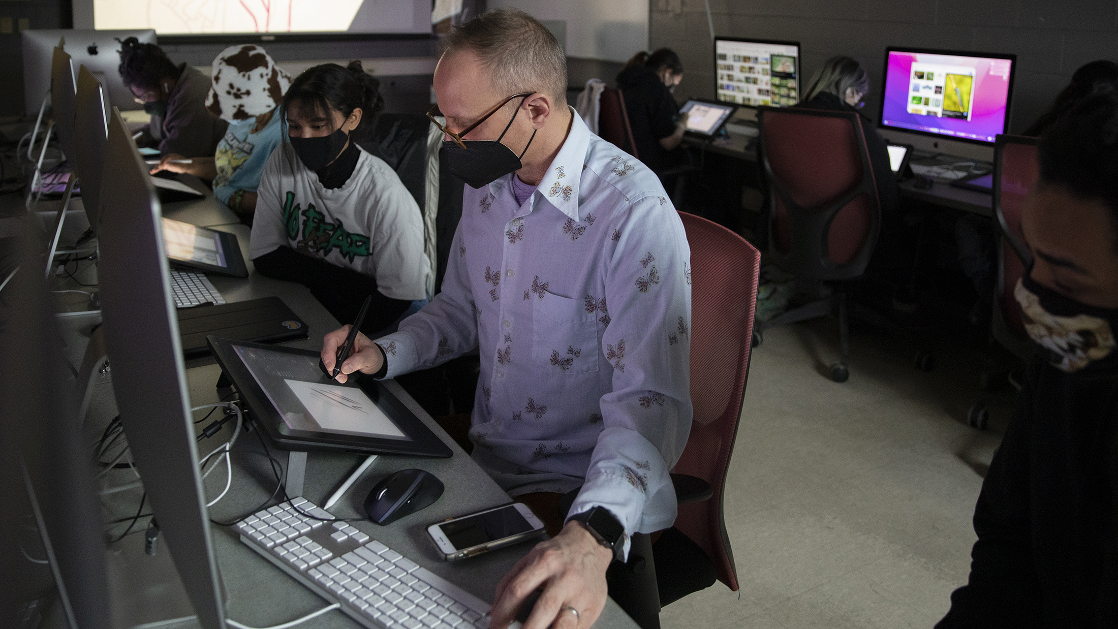 Professor Chad Grohman teaches illustration in a computer lab.