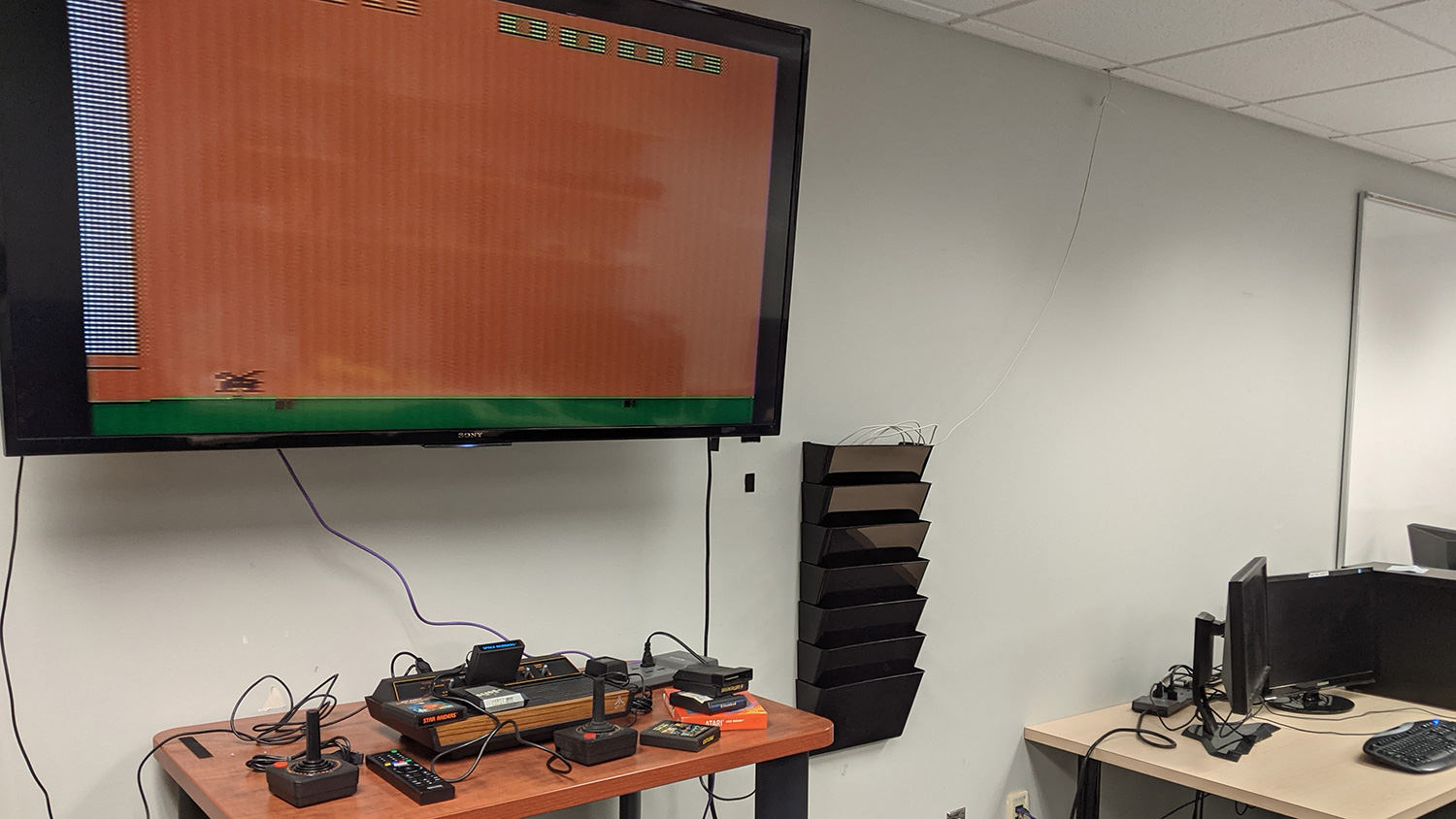 Lab with an Atari 2600 on a flat screen TV.