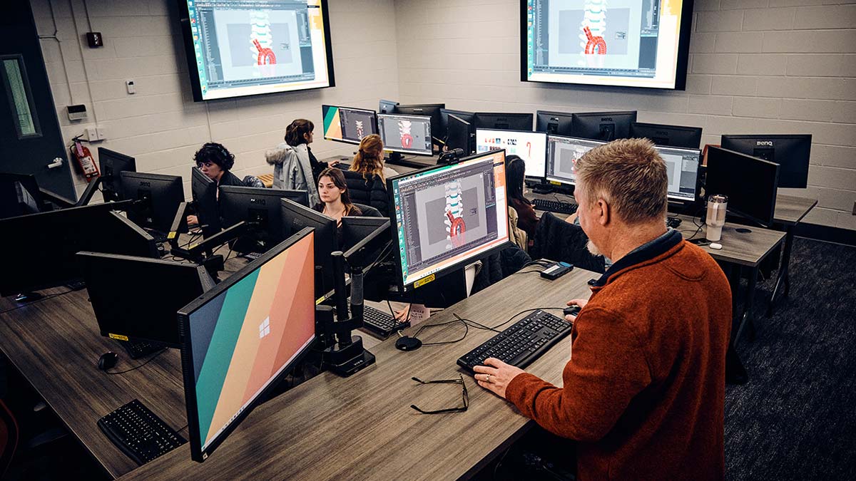 A group of medical illustration students work in a lab.