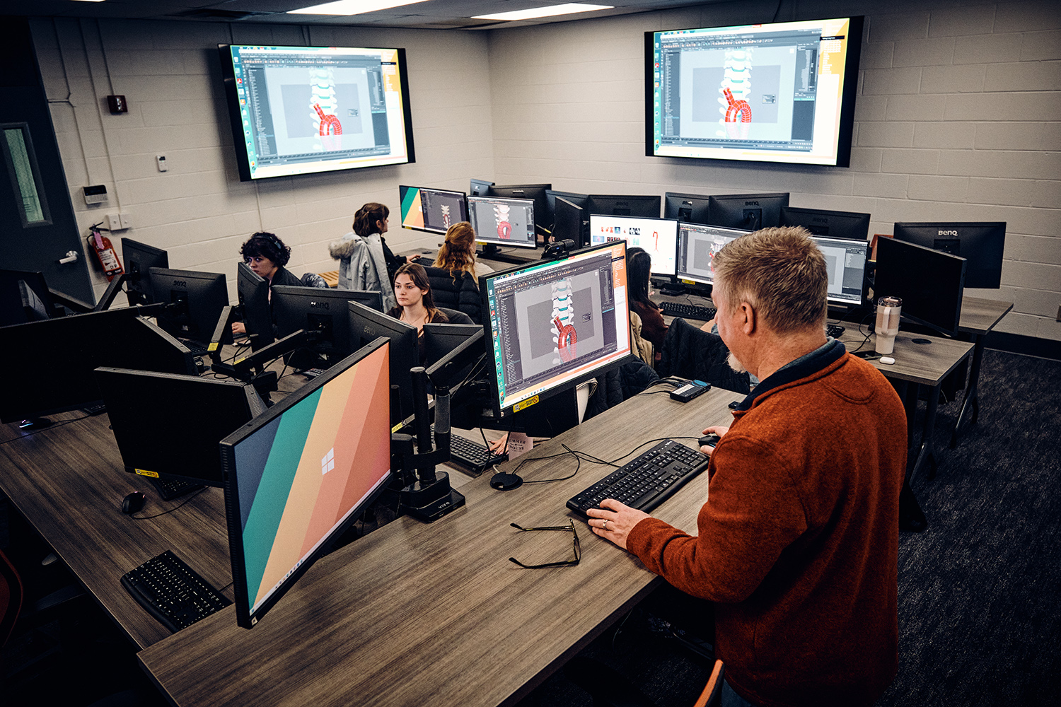 A group of medical illustration students work in a lab.