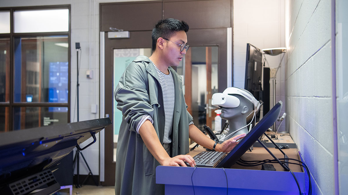 Student Gabe Cagera works on screen in the New Media Workshop.