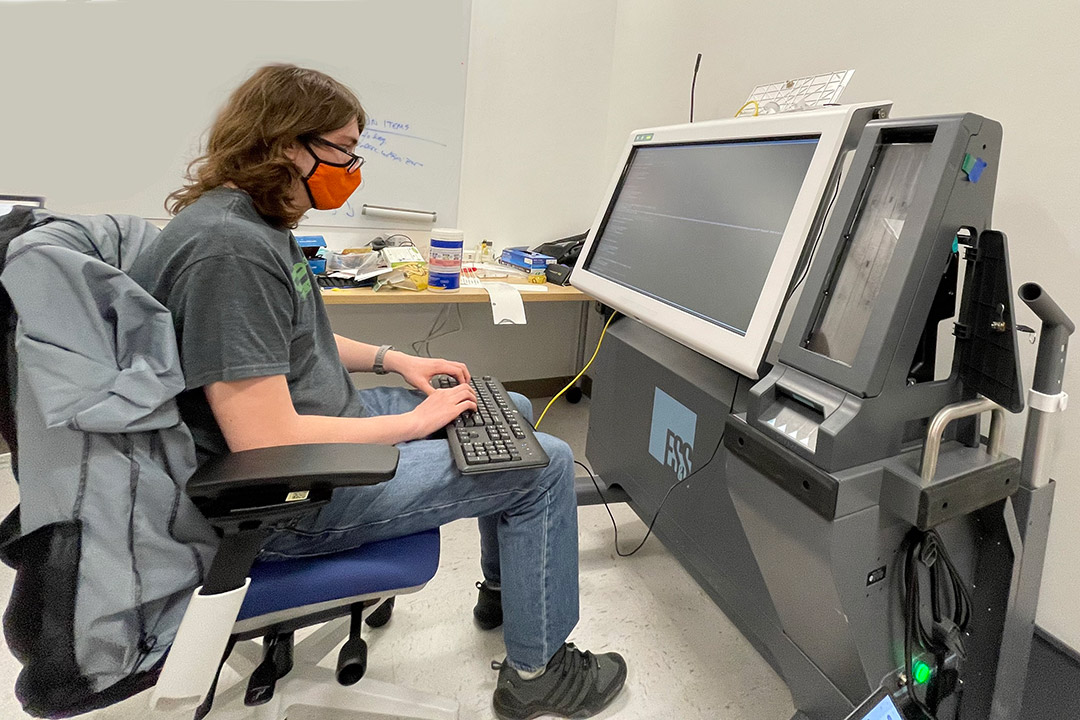 Student working on Voting Machine Project.