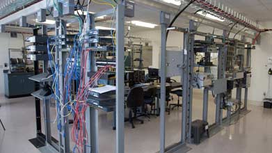 Server room with a cable management system running above server racks