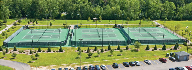 Aerial view of 9 tennis courts.