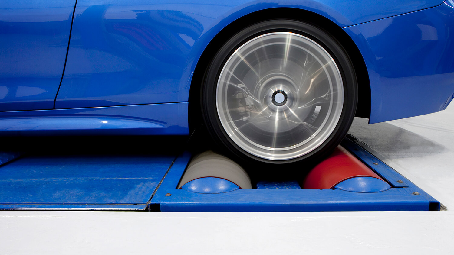 Wheel spinning on a chassis dynamometer.