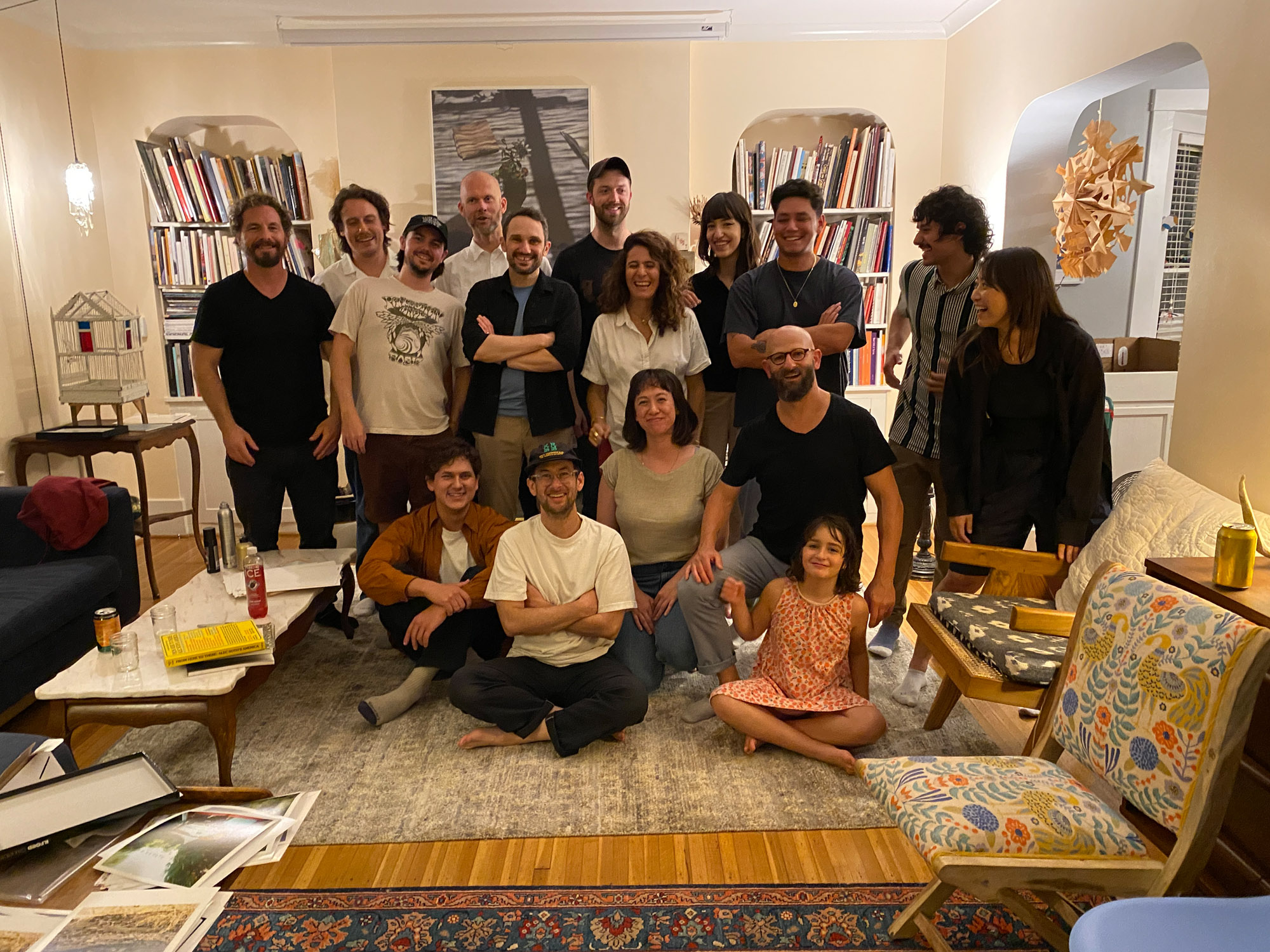 A group of people post for a portrait with silly faces.