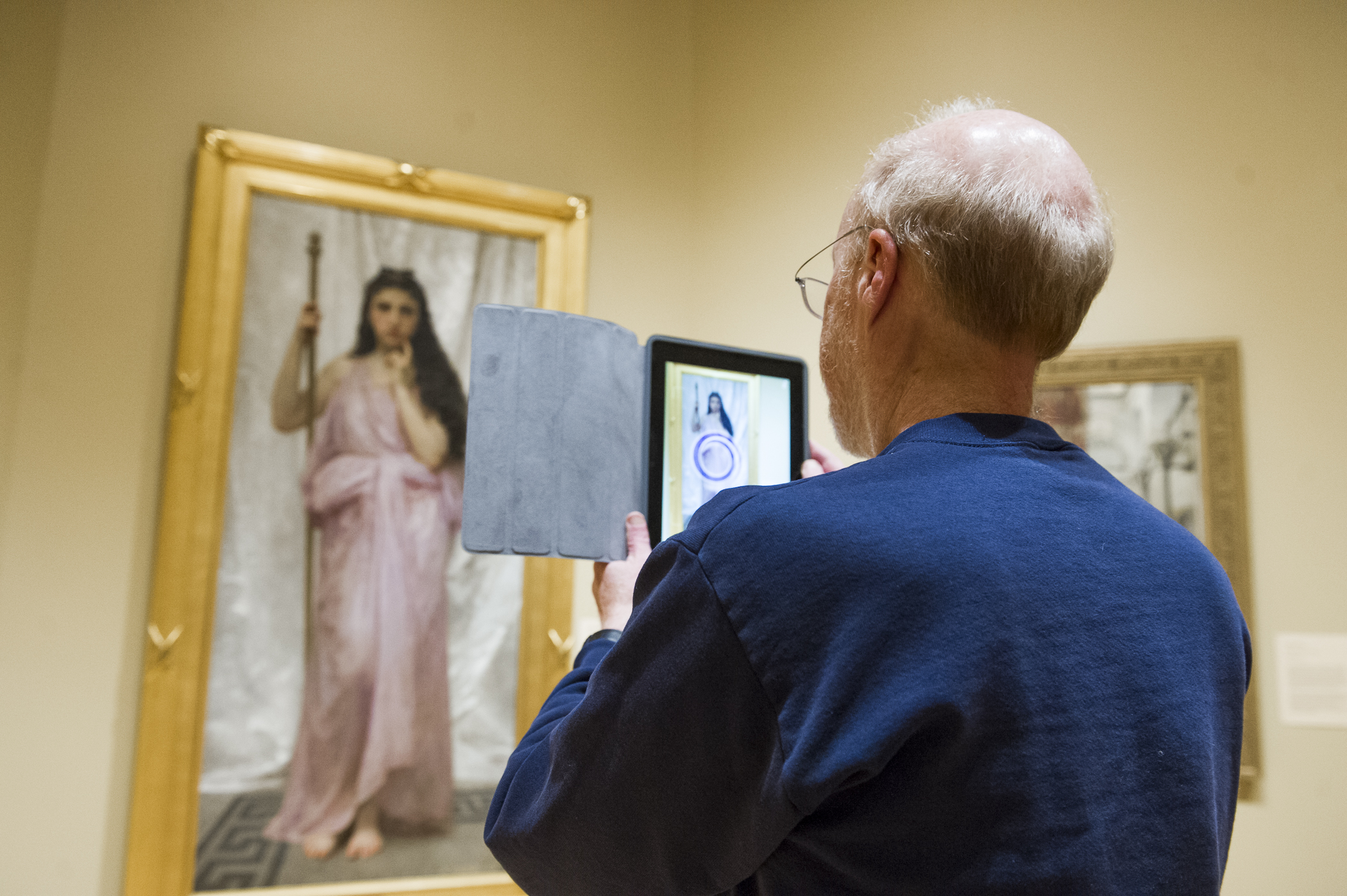 Photo by David Beyerlein: A Memorial Art Gallery visitor brings a painting to life using the CCI app. 