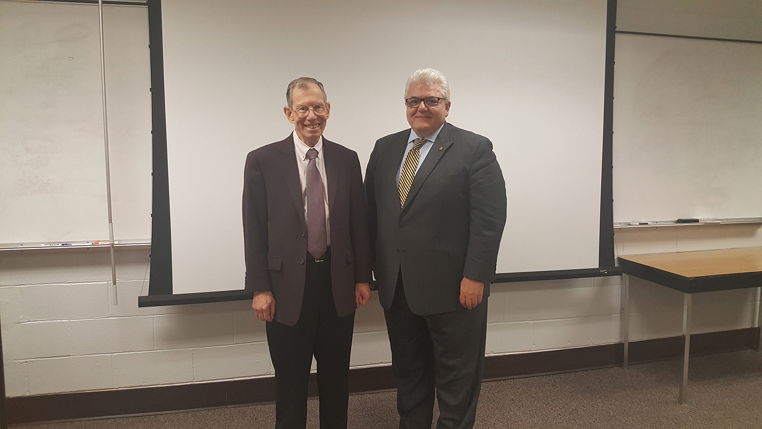 Bob Eller and Frank Passarelli pose next to each other