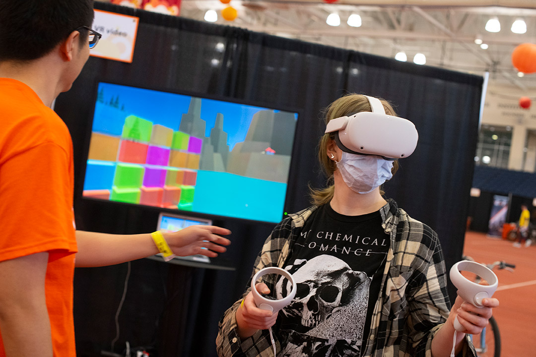 person using a virtual reality headset and handhelds.