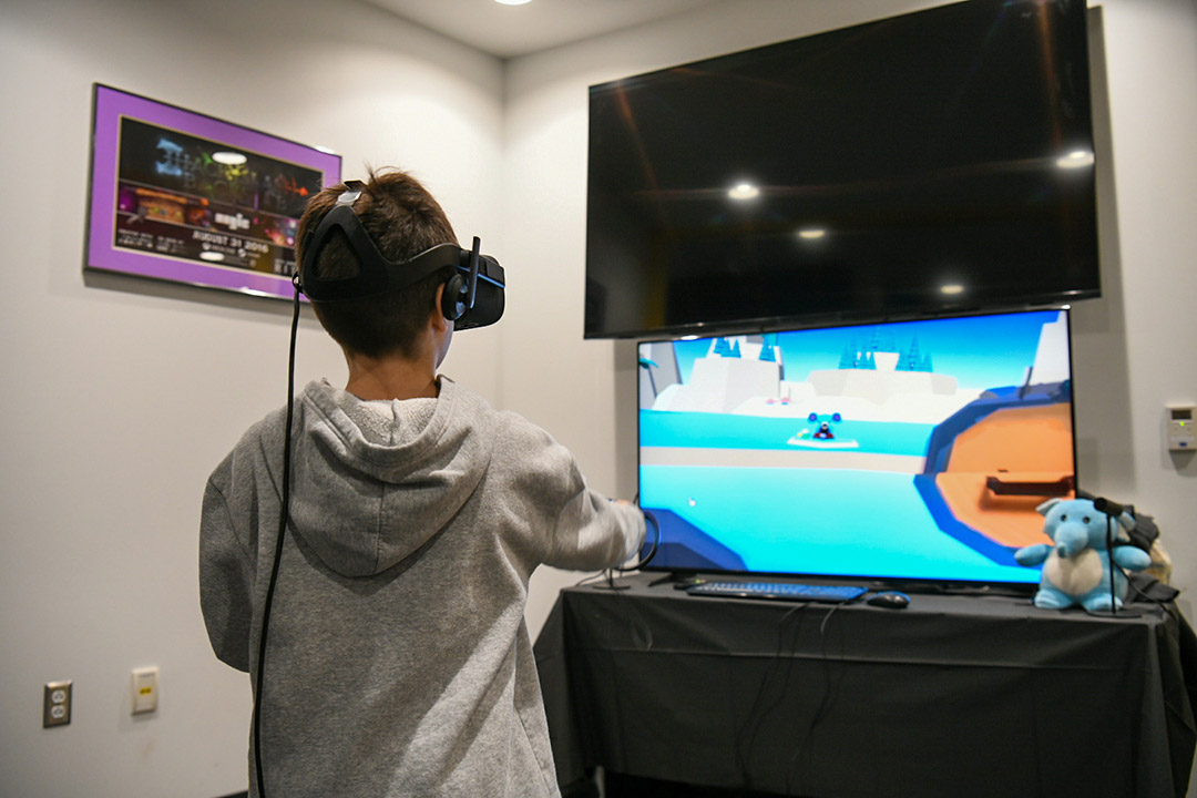 middle school student using a virtual reality headset.