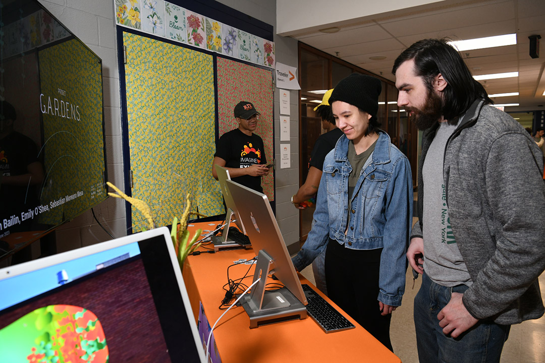 two people looking at a computer.