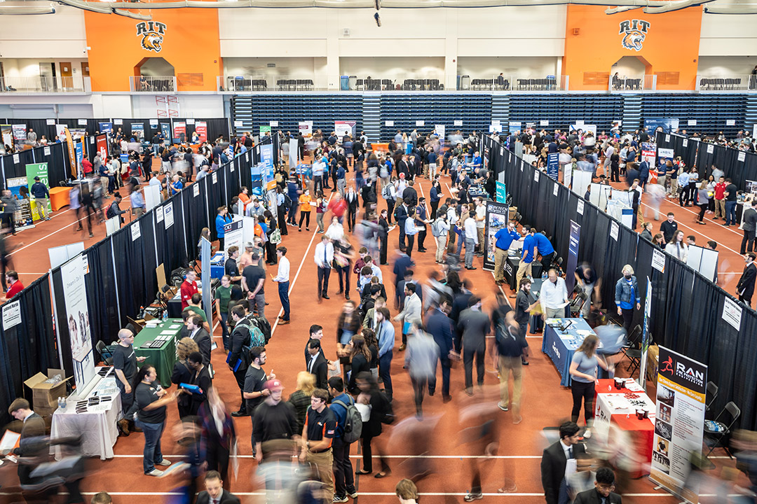 hundreds of college students and recruiters at a career fair.