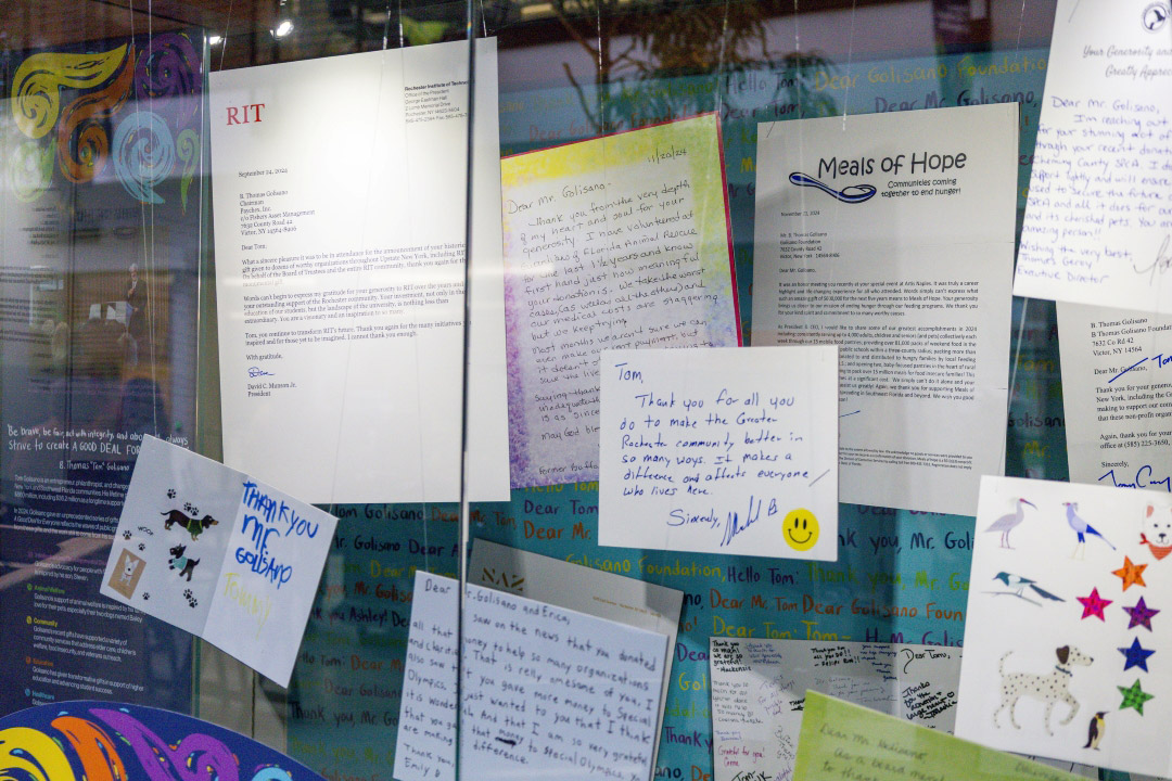 thank you cards are displayed in a window