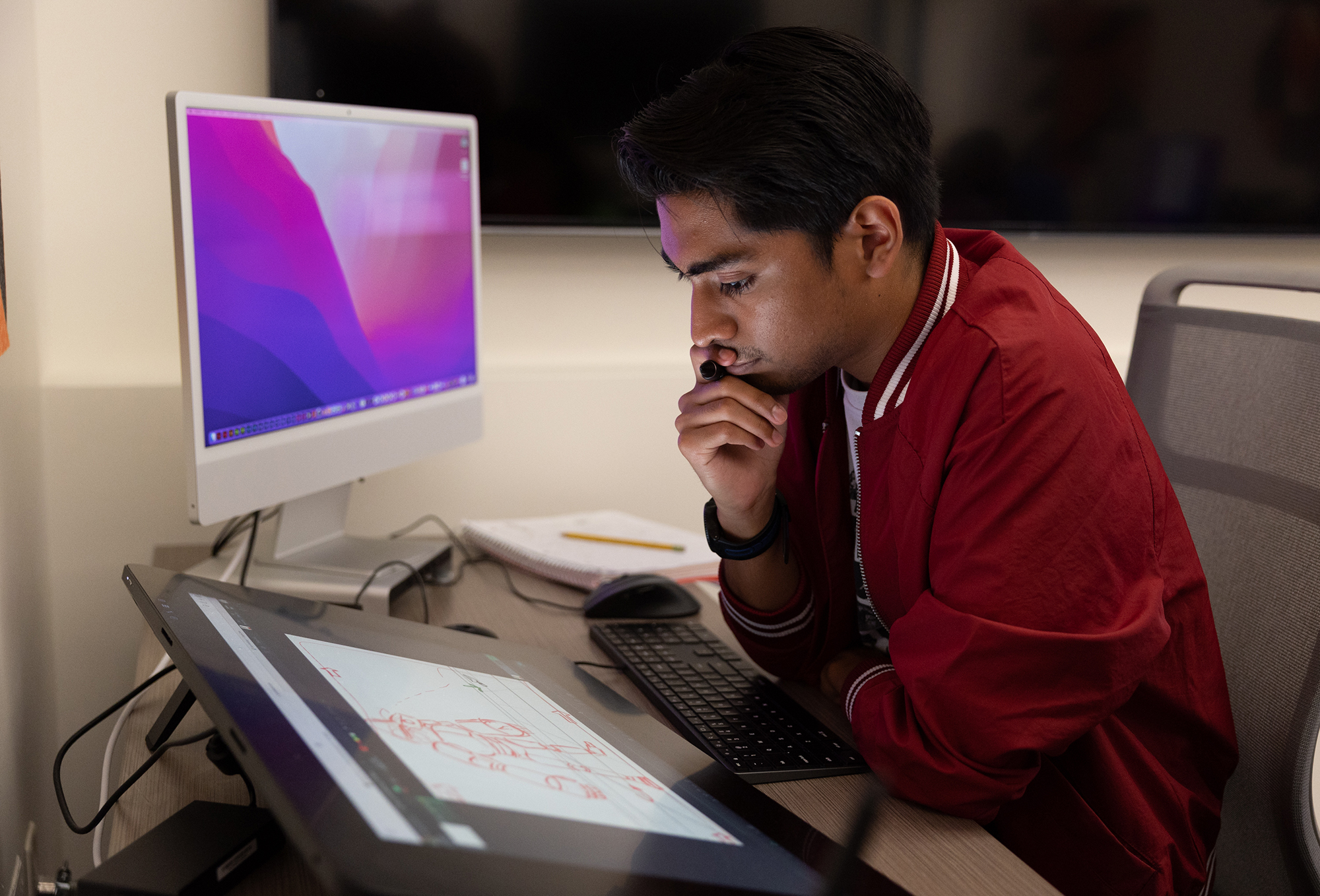 A student works on a Cintiq.