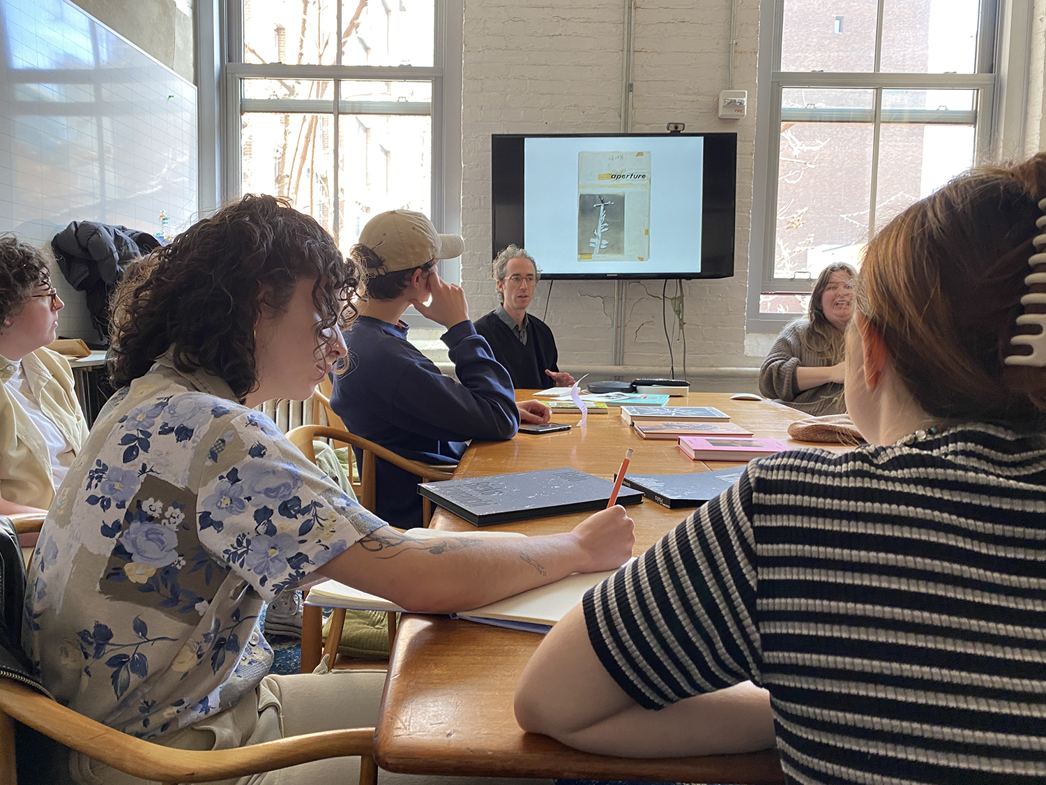 Brendan Embser, Senior Editor at Aperture, with students at the Aperture Foundation.