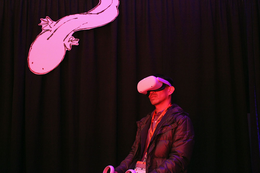 A fim festival visitor wears a VR heasdset.