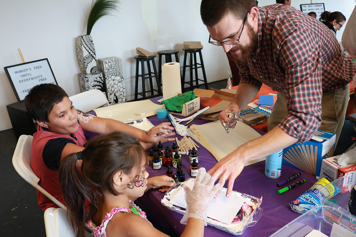 Dan Pfohl creates art with local youth.