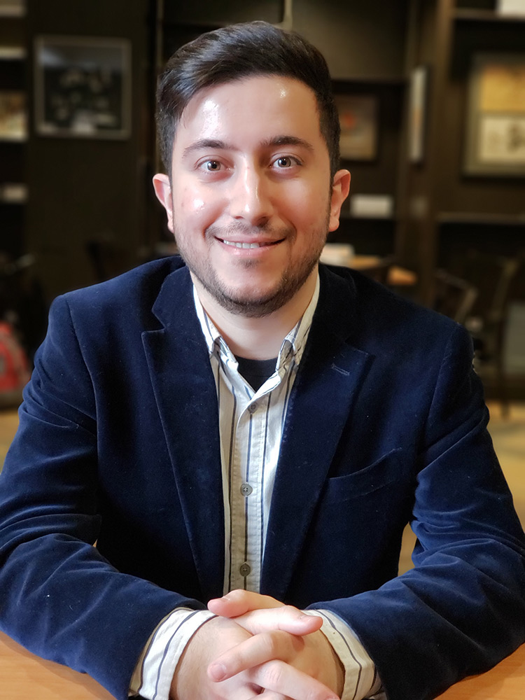 Male student with blue sports coat