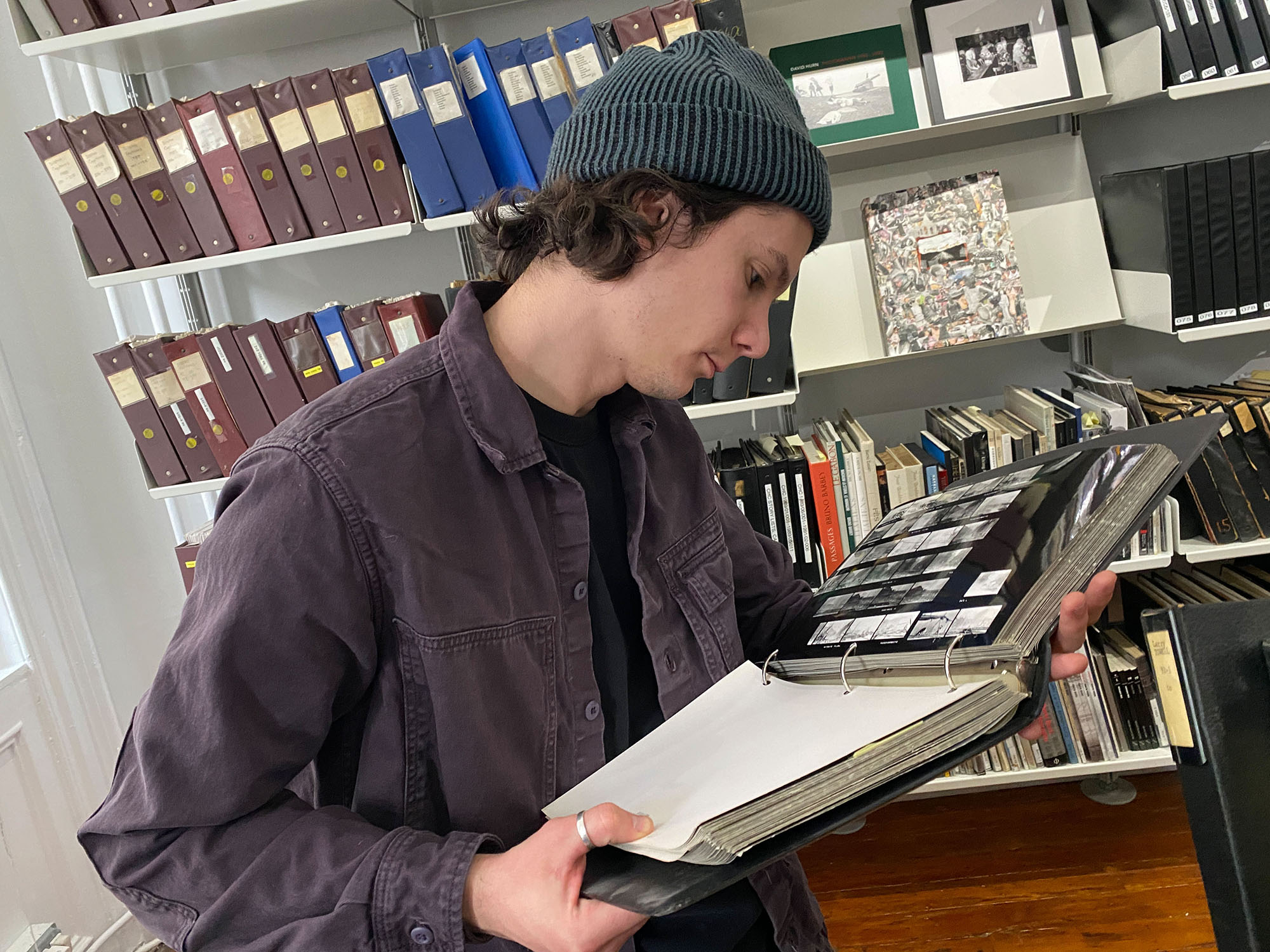 MFA student Daniil Kolchanov looking through Robert Capa’s contact sheets at Magnum Photos, New York.