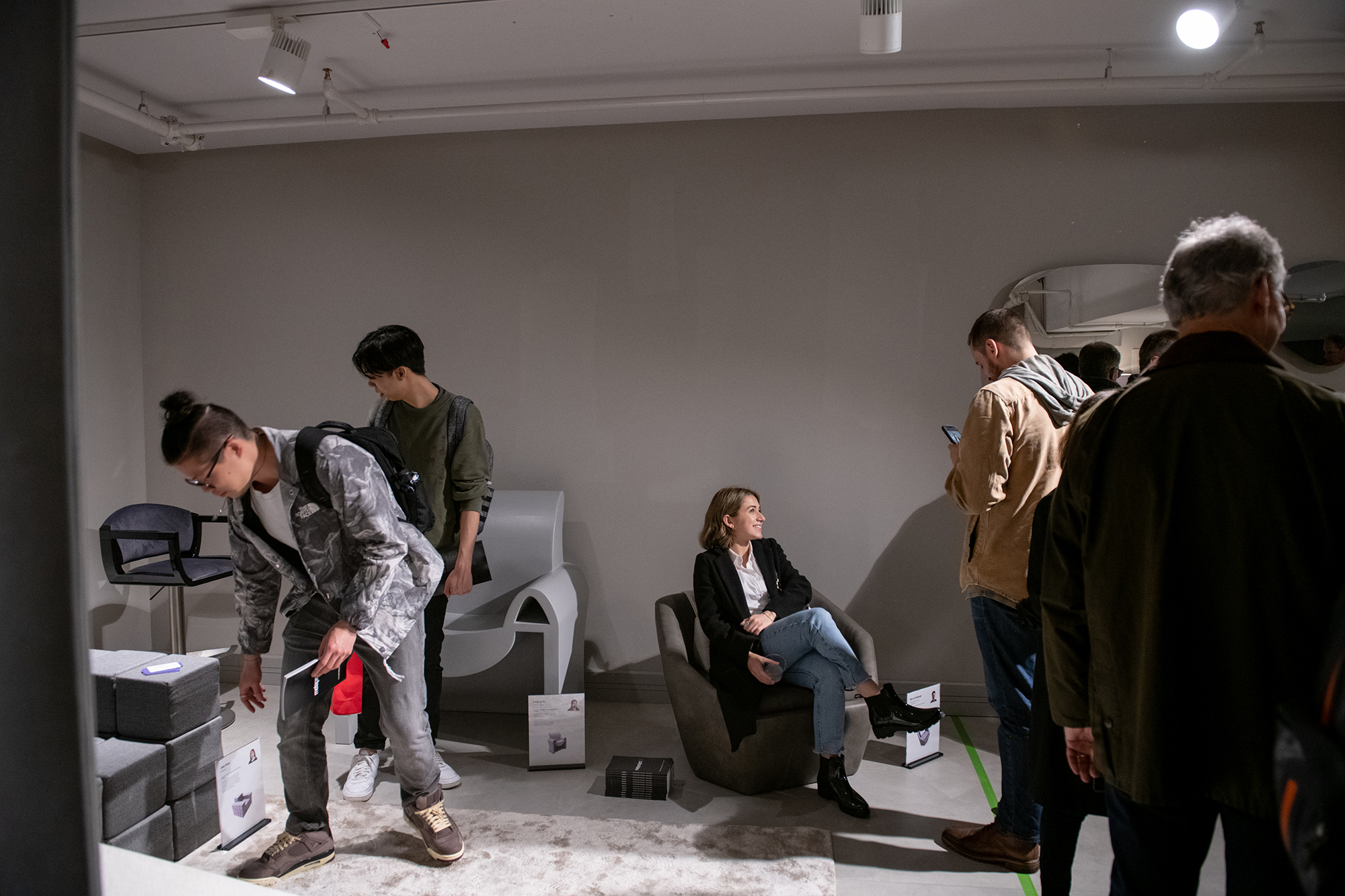 Event attendees test out students' seating solutions.