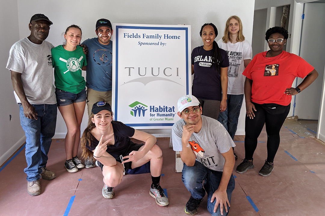 Group of students in building under construction.