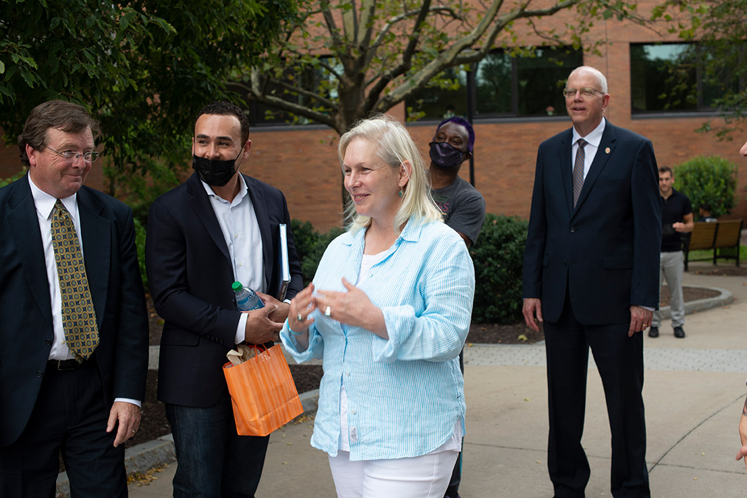 four administrators standing outside.