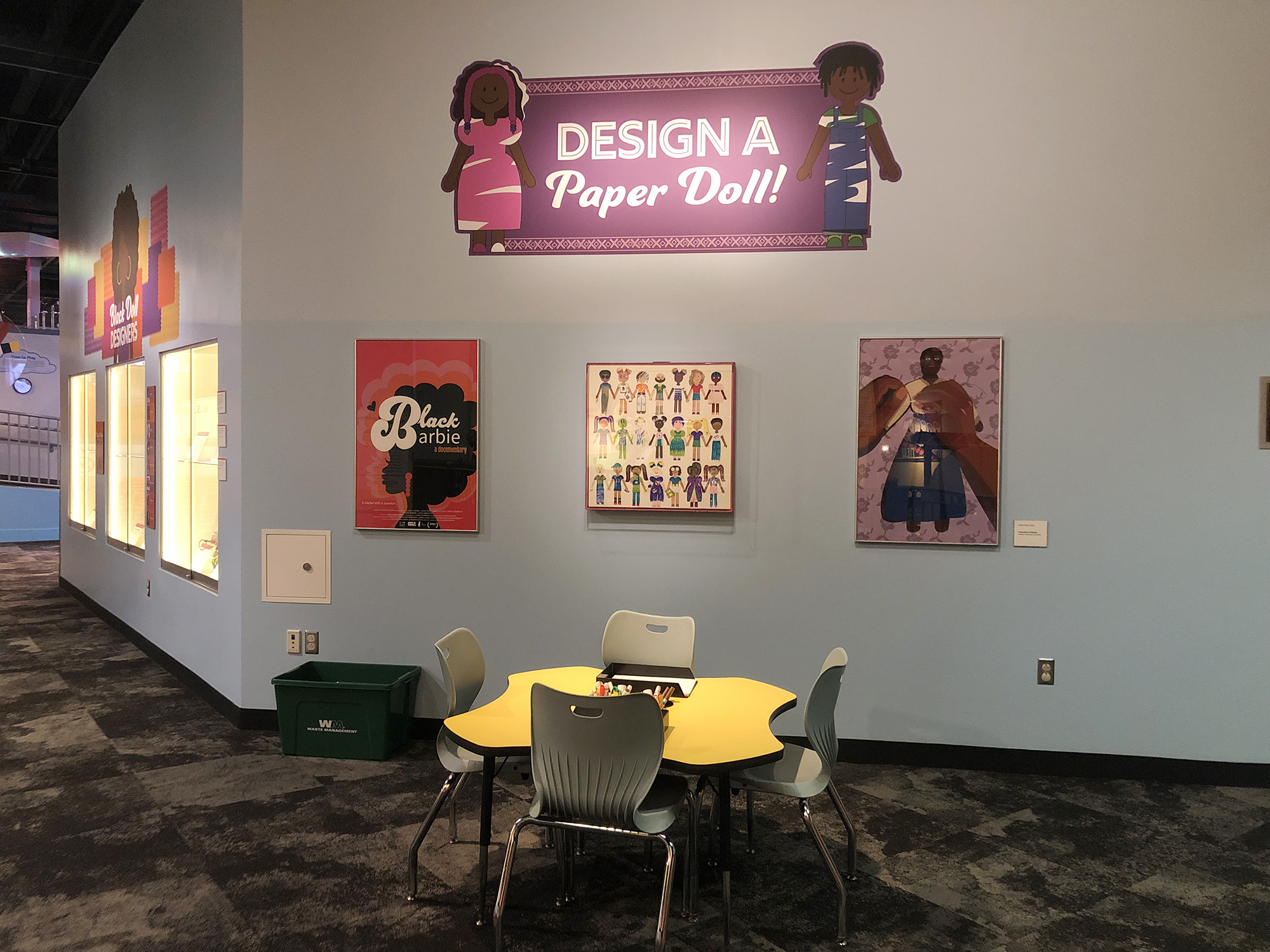 An area for exhibit visitors to make a paper doll.