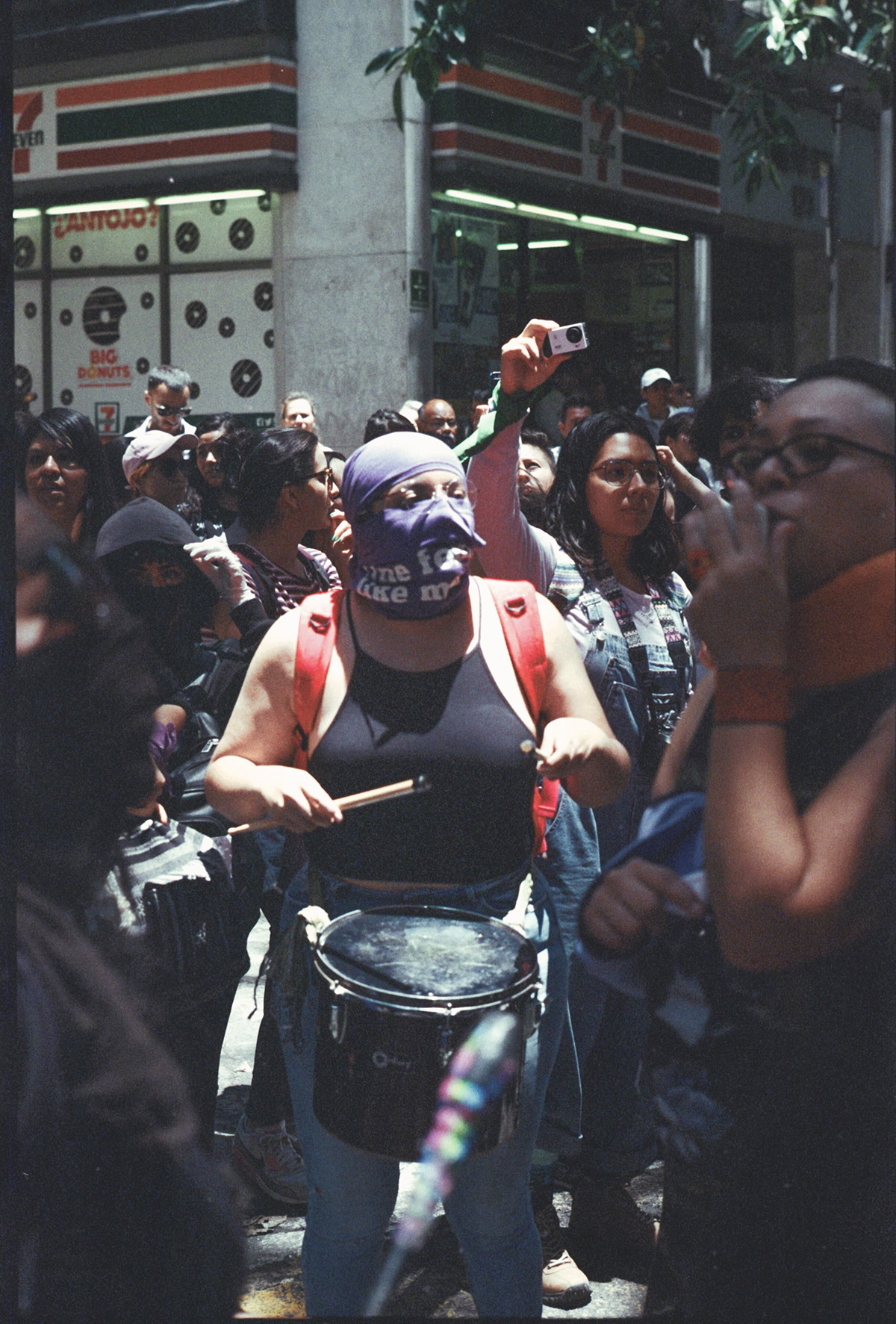 A group of people in a crowded city street.