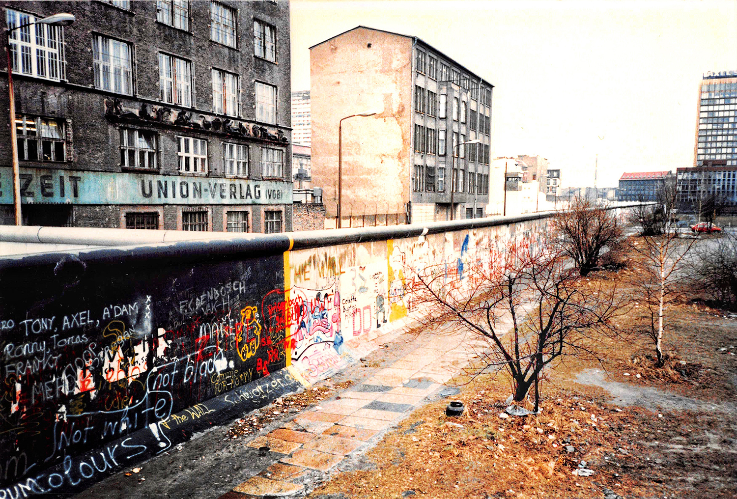 A photo of the Berlin Wall, painted with graffiti. 