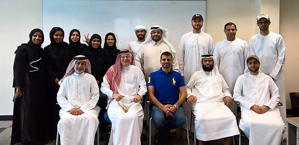 men and women posing for a photo in Dubai.