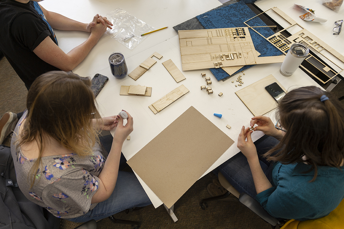 An overhead photo of Interior Design students working collaboratively in the studio.