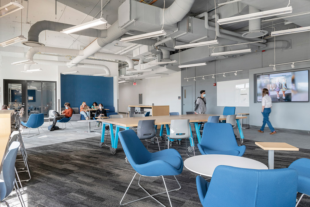 student lounge with tables and chairs.