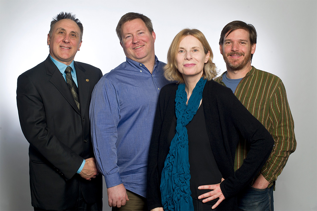 Group of four researchers standing.