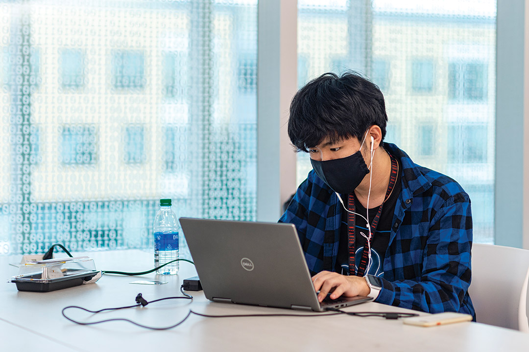 student working on a laptop computer.