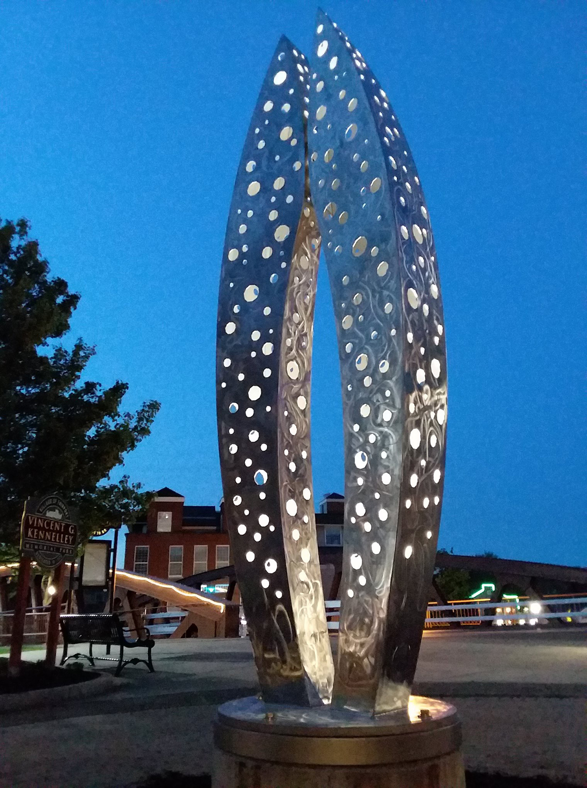 The "Connection" sculpture lit up at night