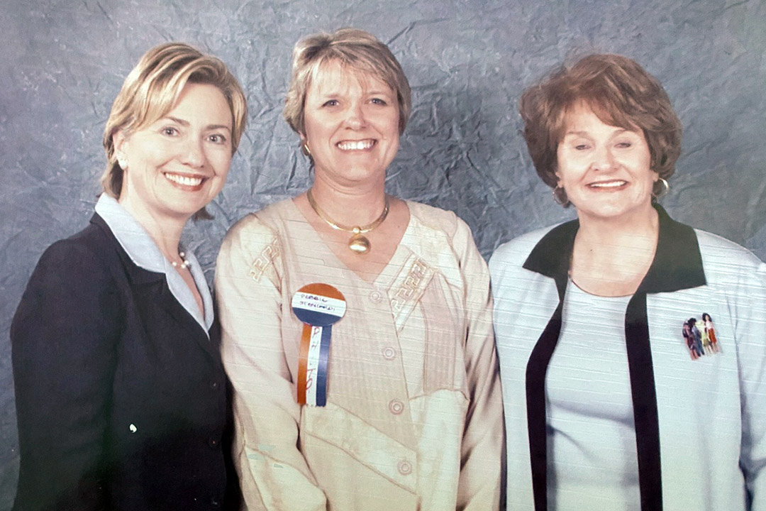 three women standing together.