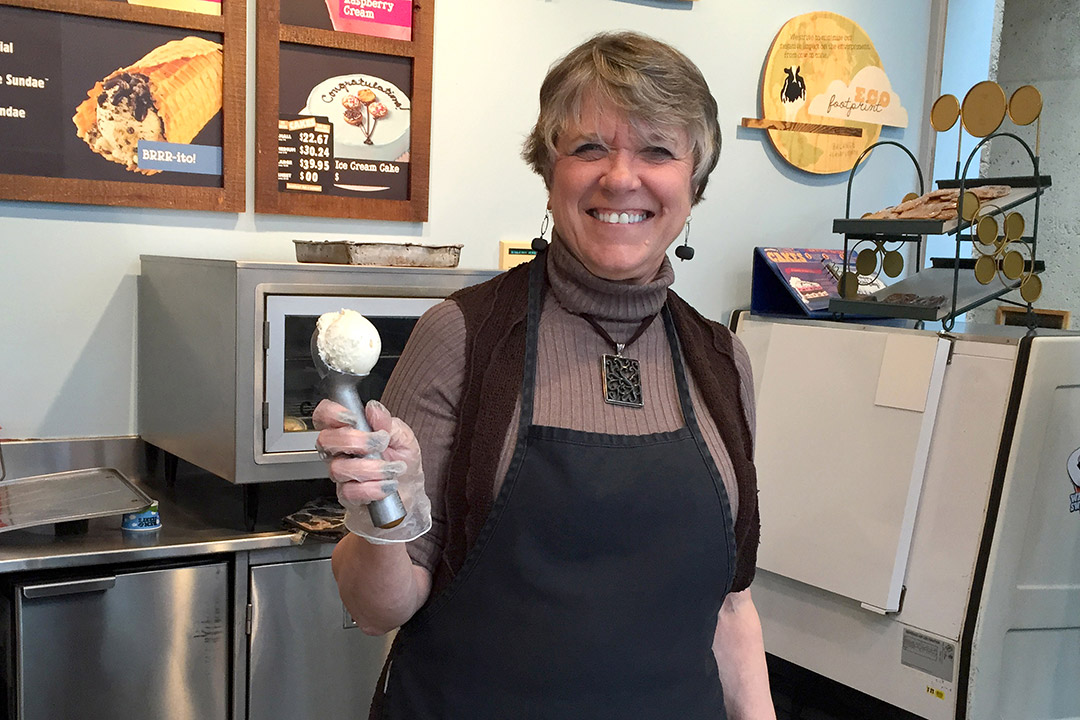 woman with ice cream scooper